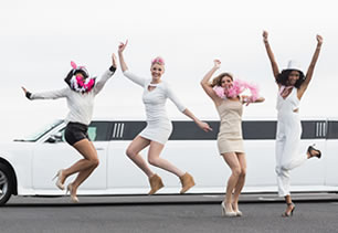 Girls partying next to limo