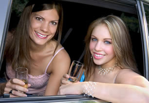 Bridesmaids in limousine