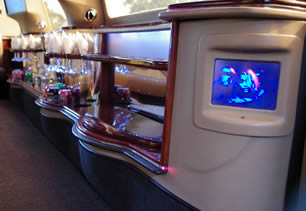 TV screens and bar area inside limousine