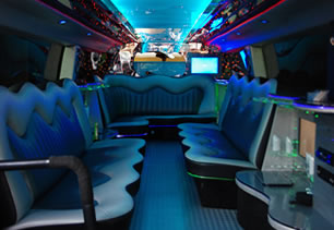 Hummer interior with bar, mood lights, champagne glasses and ice bucket